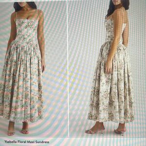 This charming maxi is shaped by a corseted bodice swingy gathered skirt & blooms